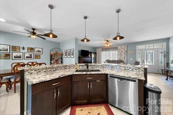 a kitchen with stainless steel appliances granite countertop counter space a sink and cabinets