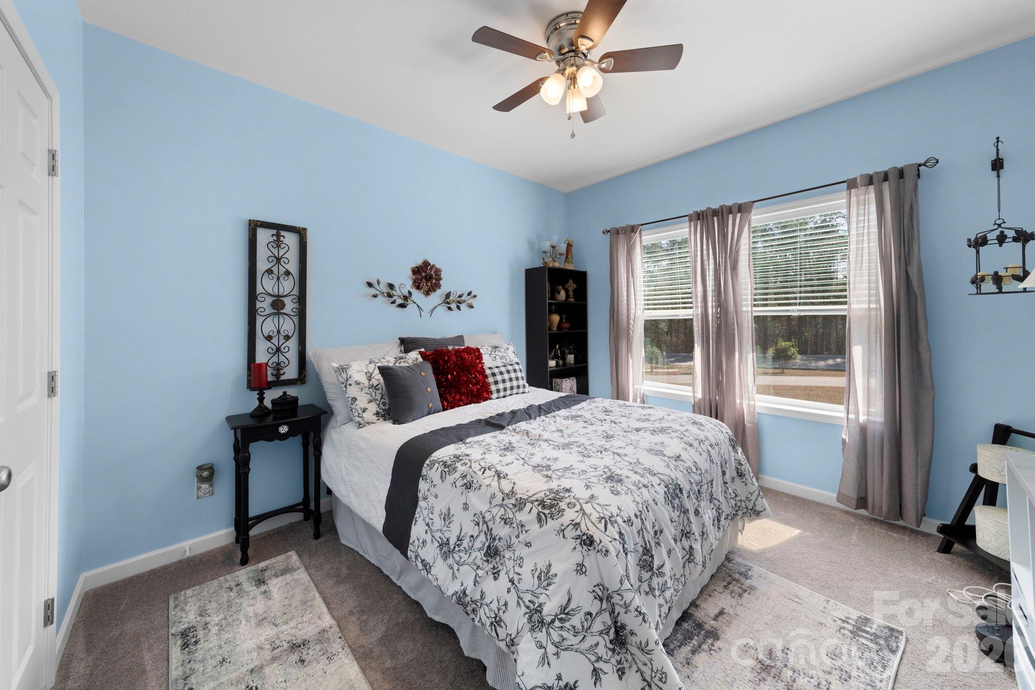 142 Will Evans Road Jefferson, SC 29718 - Photo 18 of 44 a bedroom with a large bed and a window