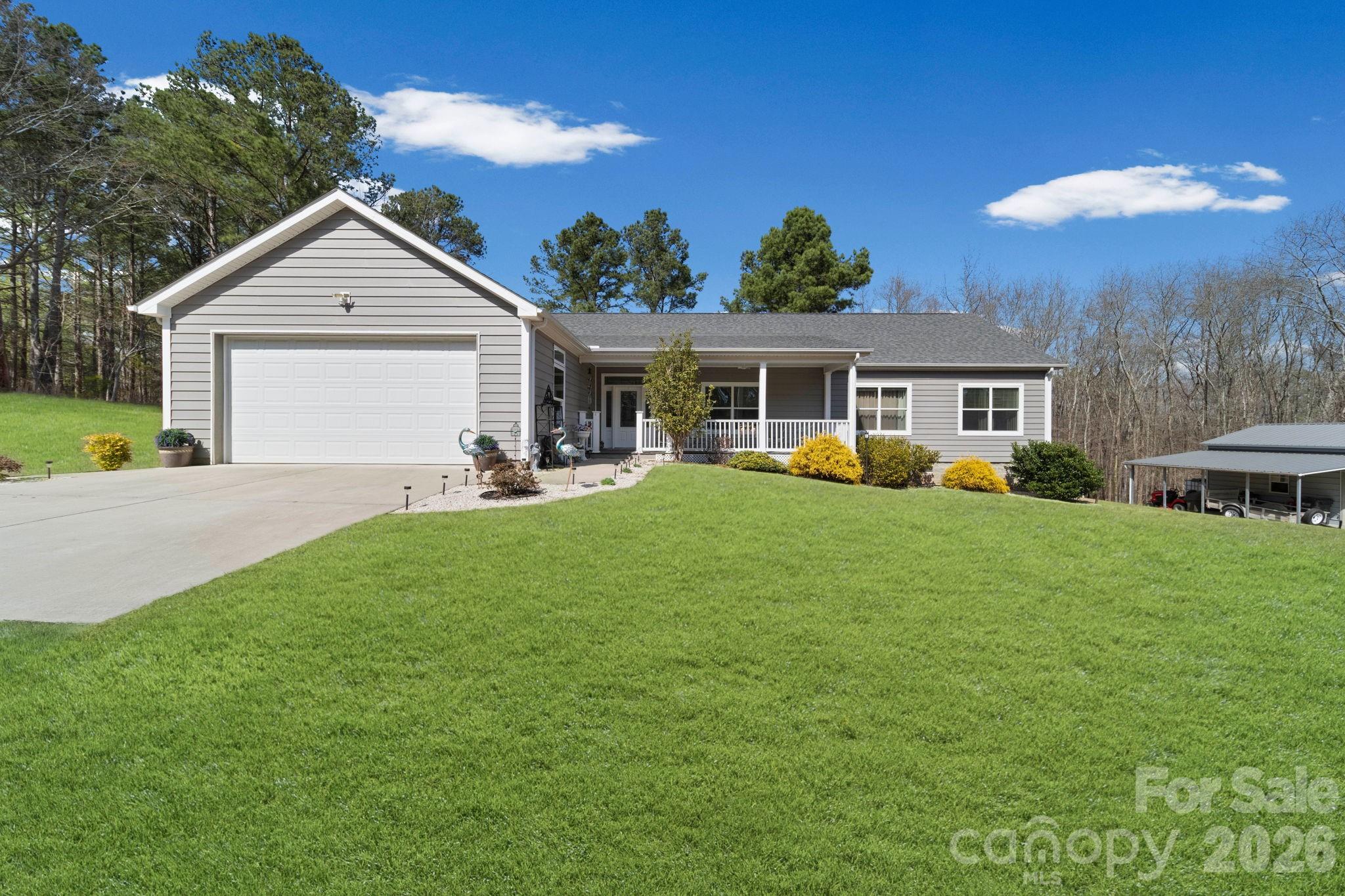 142 Will Evans Road Jefferson, SC 29718 - Photo 2 of 44 a view of a house with a backyard and a patio