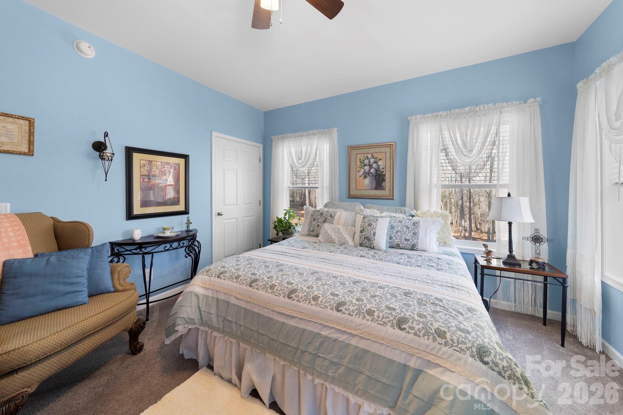 142 Will Evans Road Jefferson, SC 29718 - Photo 21 of 44 a spacious bedroom with a bed and glass windows