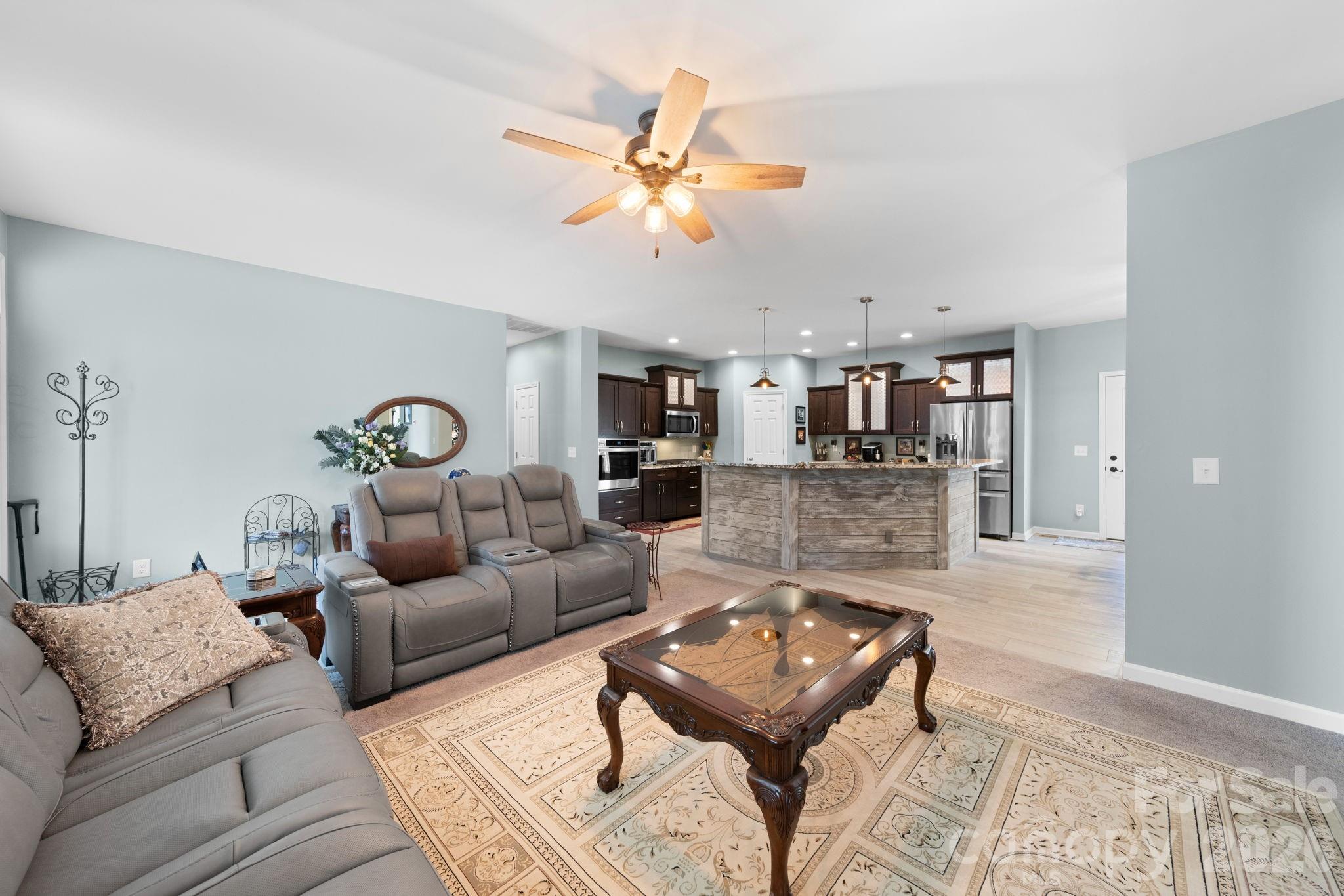 142 Will Evans Road Jefferson, SC 29718 - Photo 33 of 44 a living room with furniture and kitchen view