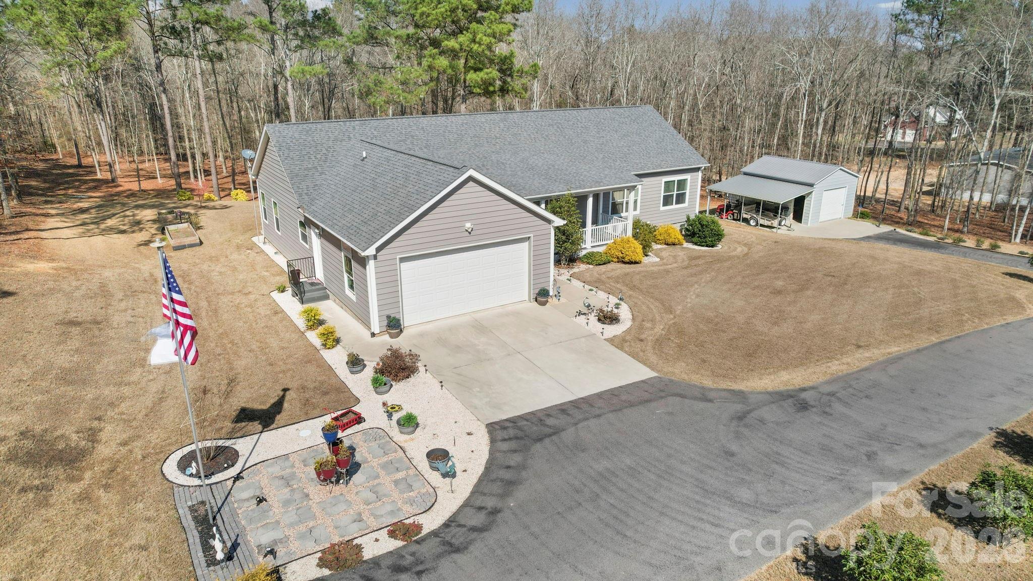 142 Will Evans Road Jefferson, SC 29718 - Photo 41 of 44 an aerial view of a house with swimming pool and large trees