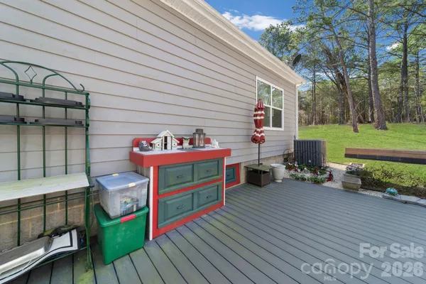 a view of a chairs and tables in the back yard of the house