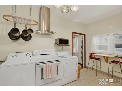 a bedroom with furniture and a flat screen tv