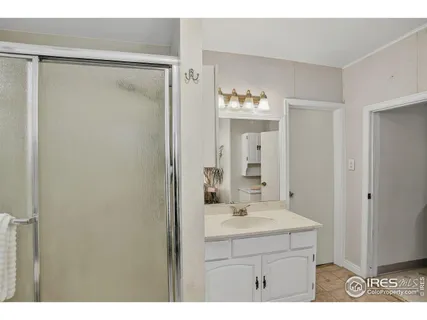 a living room with furniture a flat screen tv and a window