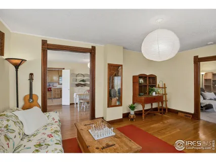 a bedroom with furniture and a mirror