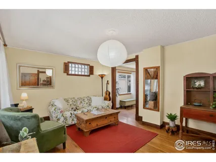 a living room with furniture and a table