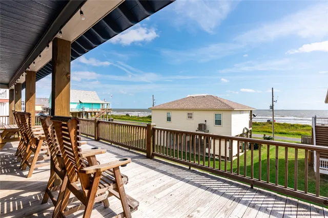 a view of a balcony with wooden floor