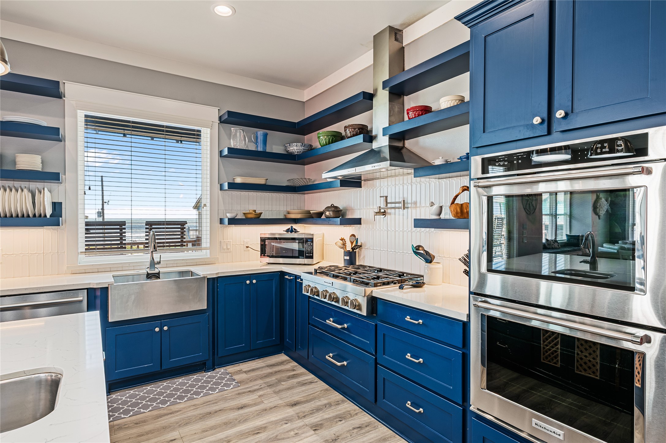 2576 Whitecap Crystal Beach, TX 77650 - Photo 20 of 49 a kitchen with stainless steel appliances granite countertop a stove a sink and a microwave
