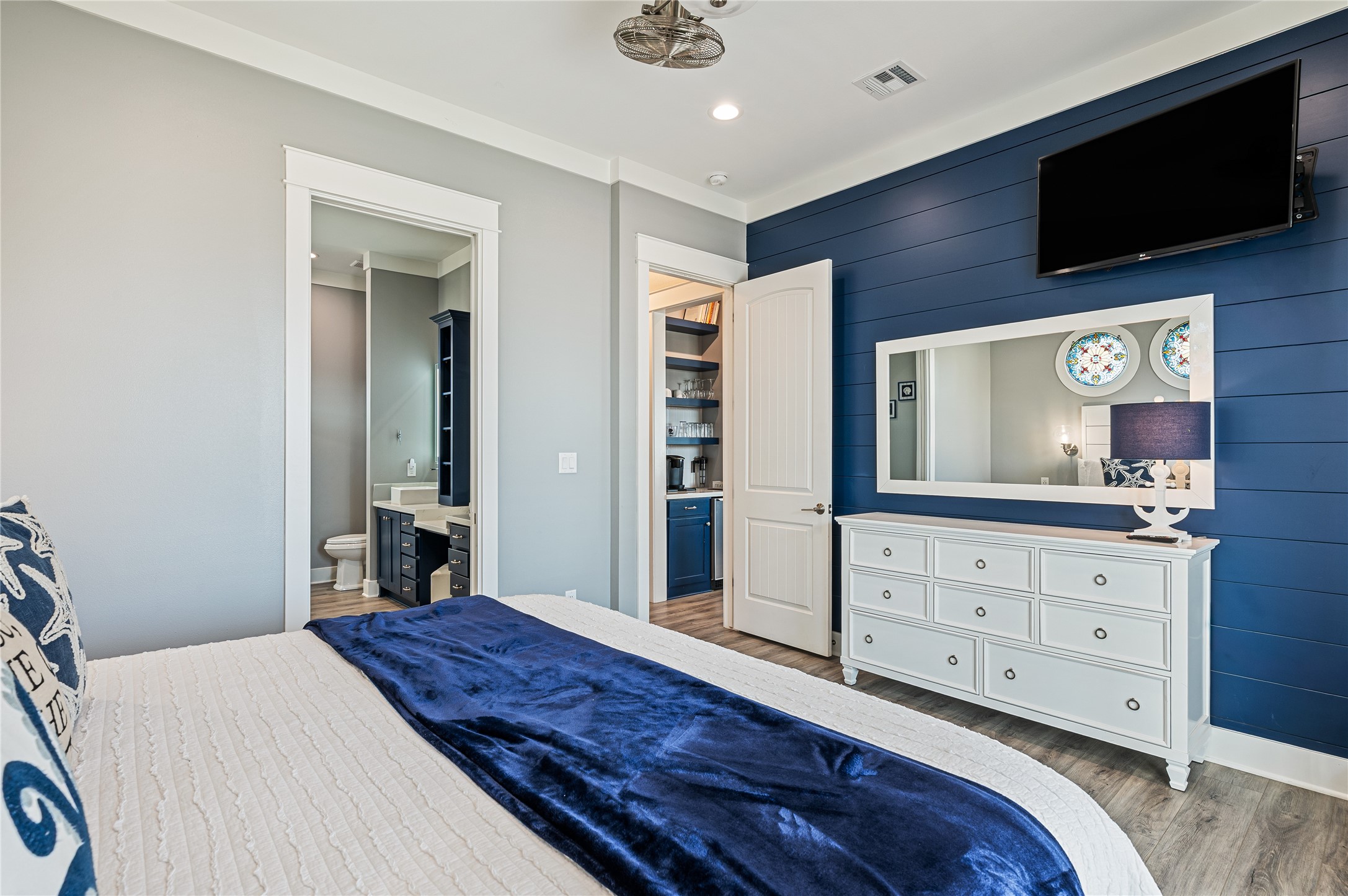 2576 Whitecap Crystal Beach, TX 77650 - Photo 24 of 49 a bedroom with a bed and a flat screen tv