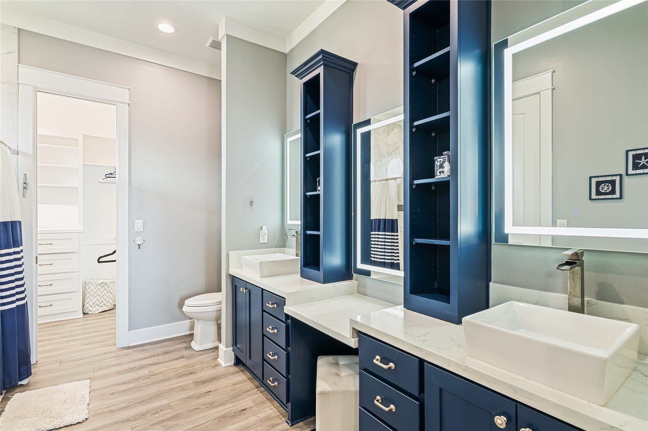 2576 Whitecap Crystal Beach, TX 77650 - Photo 25 of 49 a bathroom with a double vanity sink toilet and shower