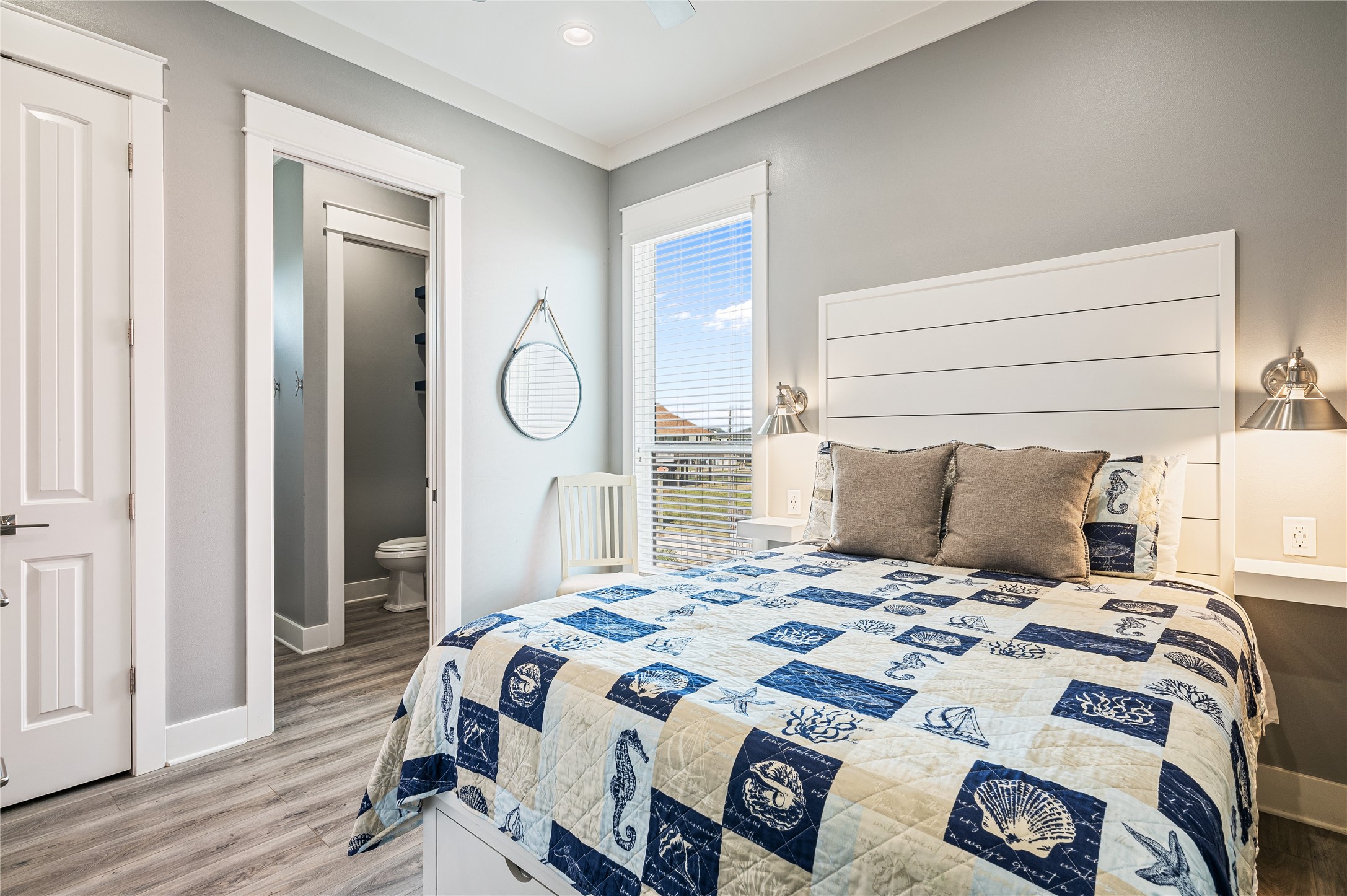 2576 Whitecap Crystal Beach, TX 77650 - Photo 29 of 49 a bedroom with a bed and wooden floor