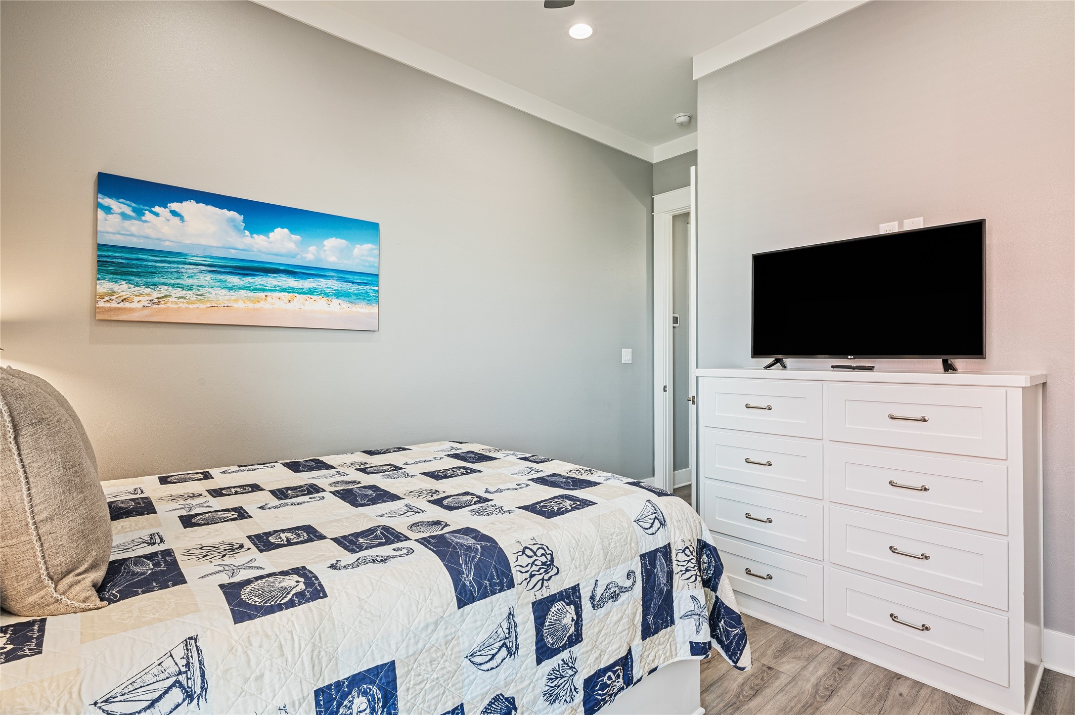 2576 Whitecap Crystal Beach, TX 77650 - Photo 30 of 49 a bedroom with a bed and a flat screen tv