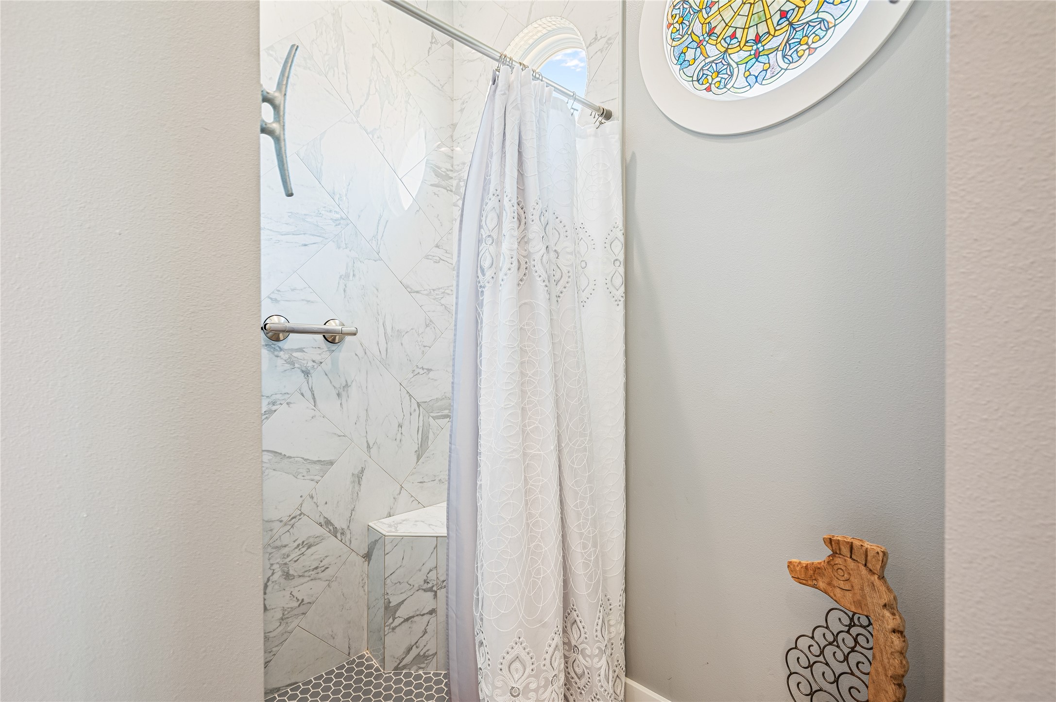 2576 Whitecap Crystal Beach, TX 77650 - Photo 32 of 49 a bathroom with a shower curtain and a window