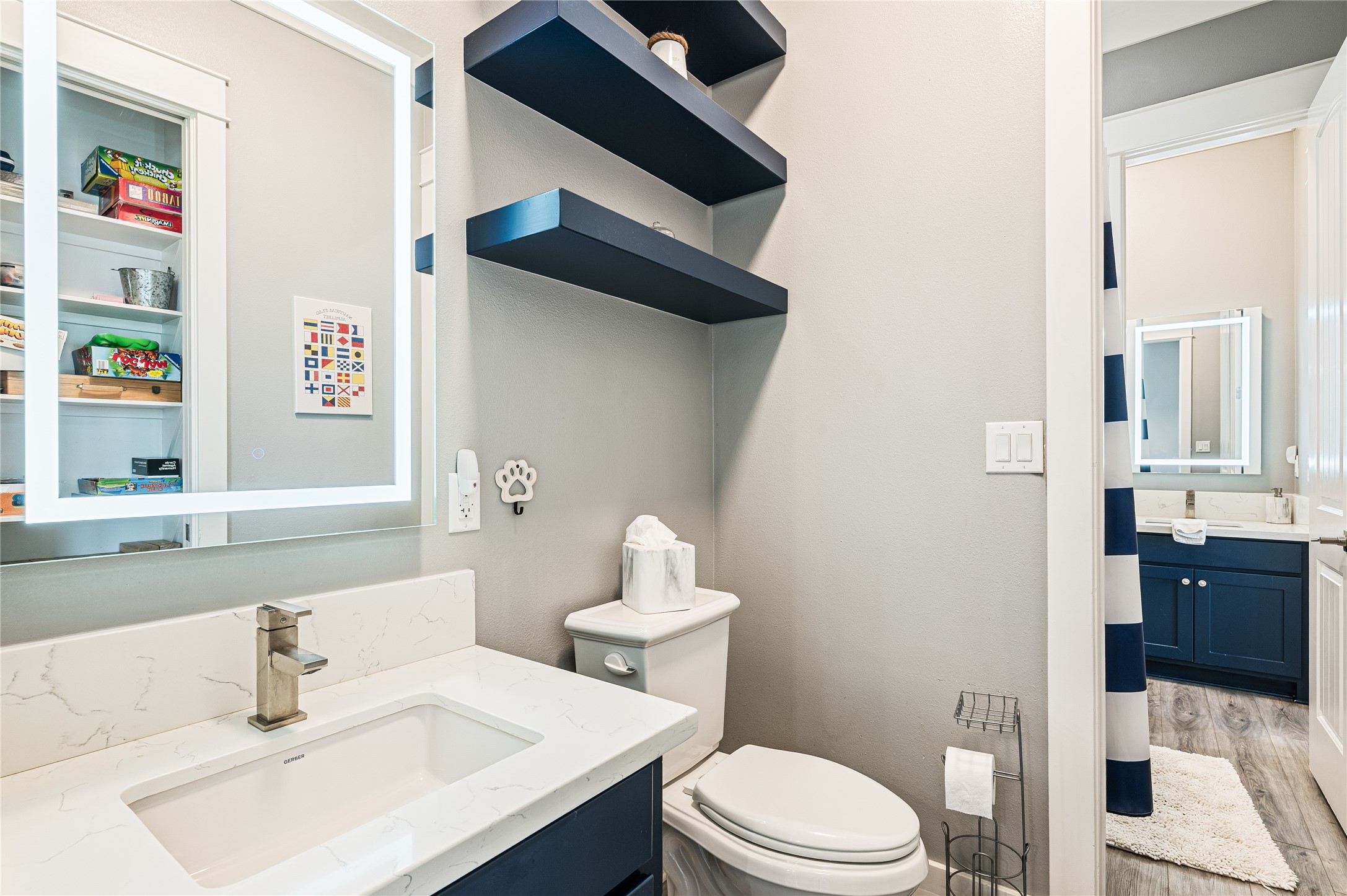 2576 Whitecap Crystal Beach, TX 77650 - Photo 35 of 49 a bathroom with a sink toilet and vanity