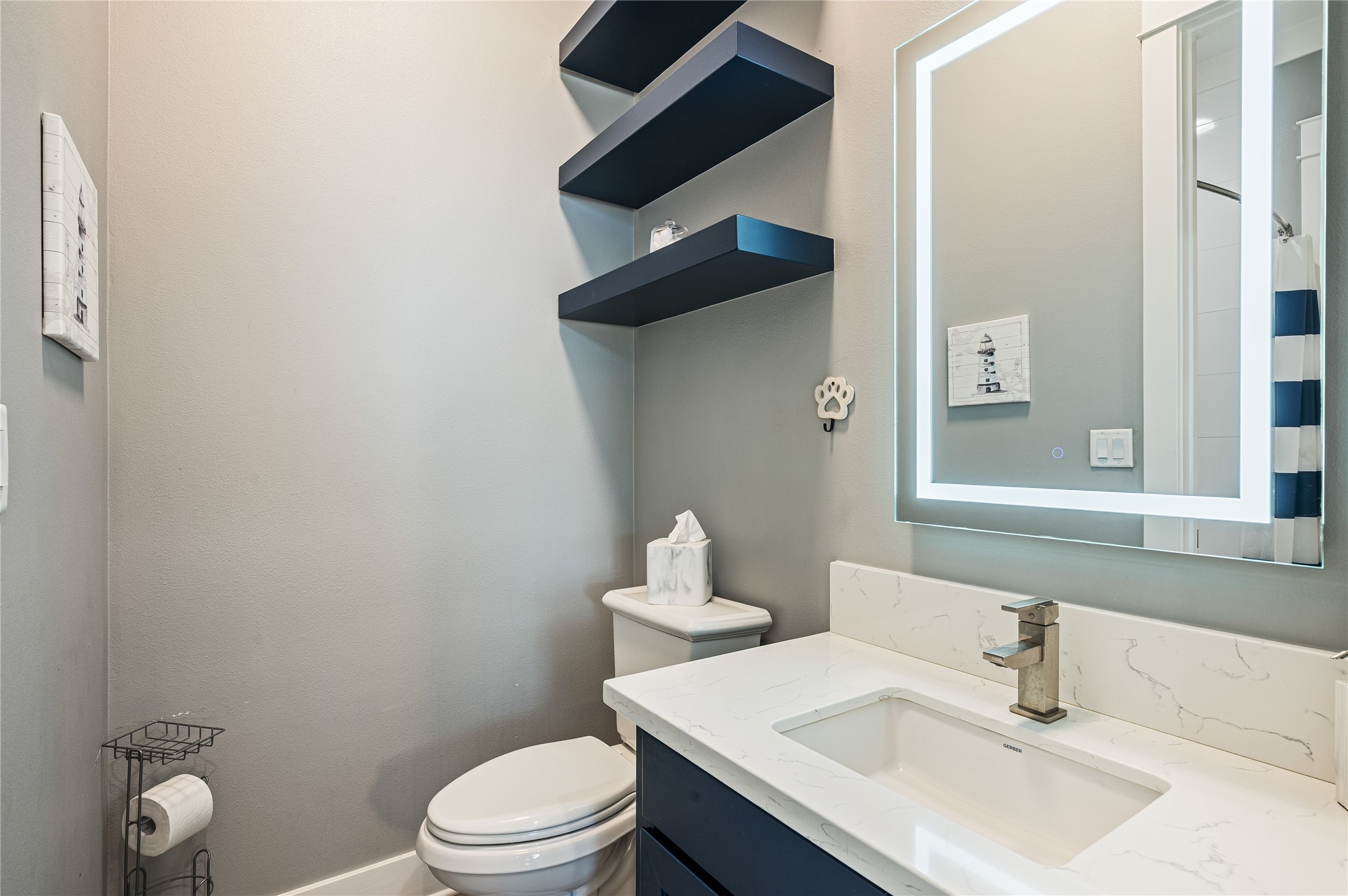2576 Whitecap Crystal Beach, TX 77650 - Photo 37 of 49 a bathroom with a sink toilet and vanity