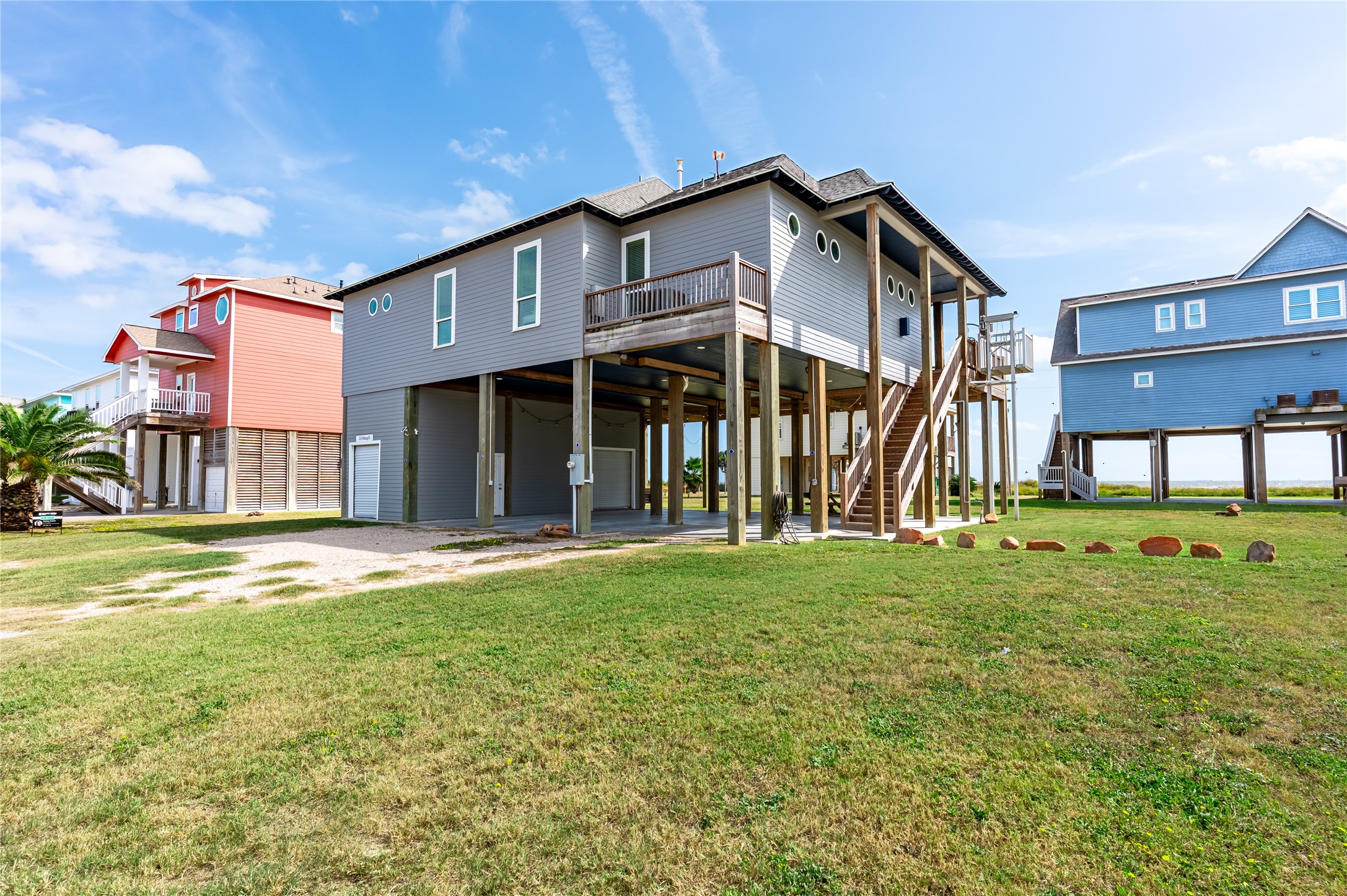 2576 Whitecap Crystal Beach, TX 77650 - Photo 48 of 49 a view of a house with a yard and deck
