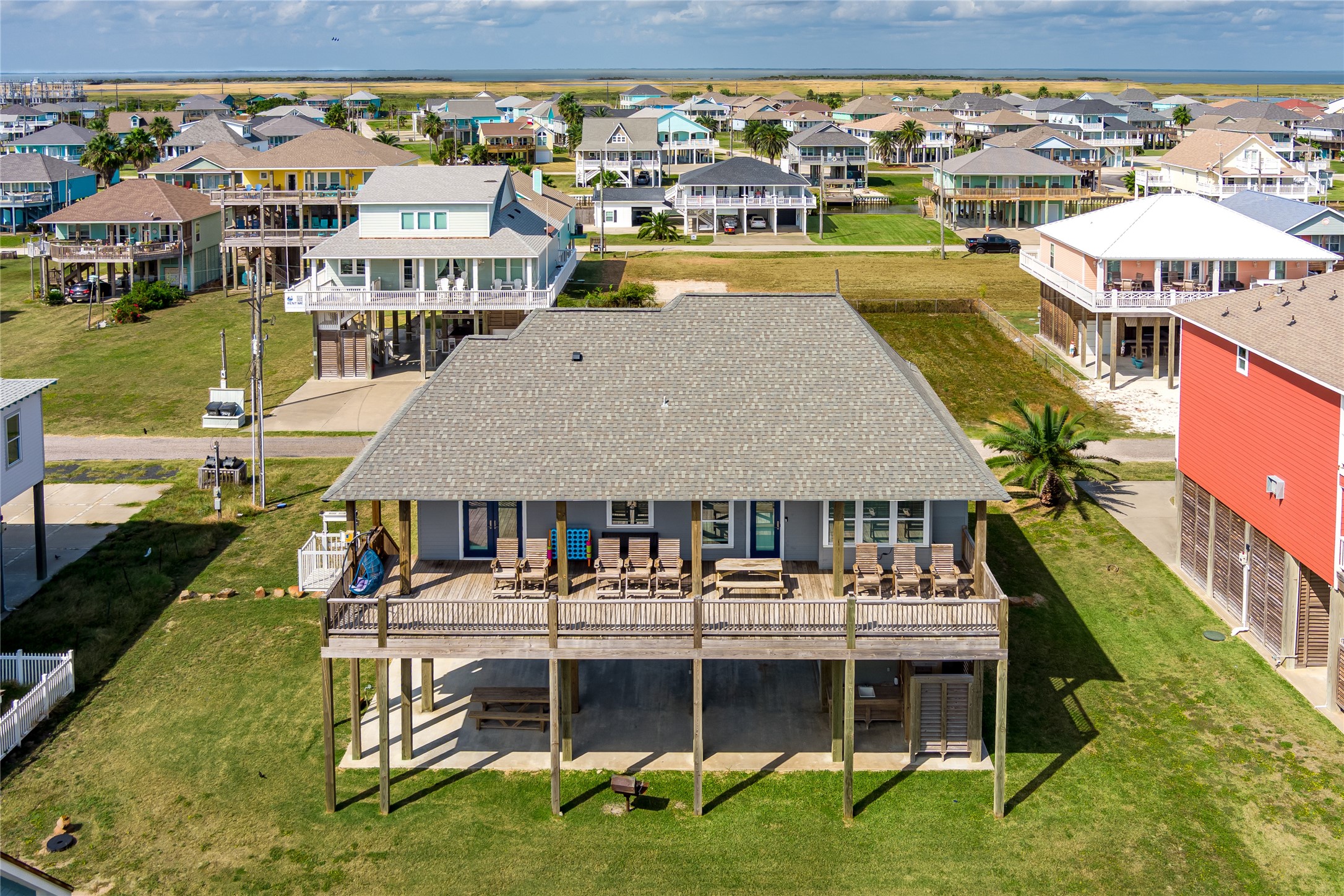 2576 Whitecap Crystal Beach, TX 77650 - Photo 6 of 49 a aerial view of a house with a garden and lake view