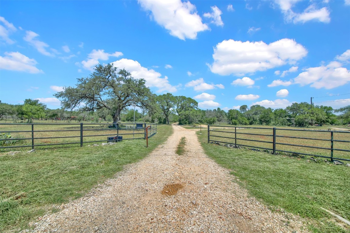 a view of road with grass and a view