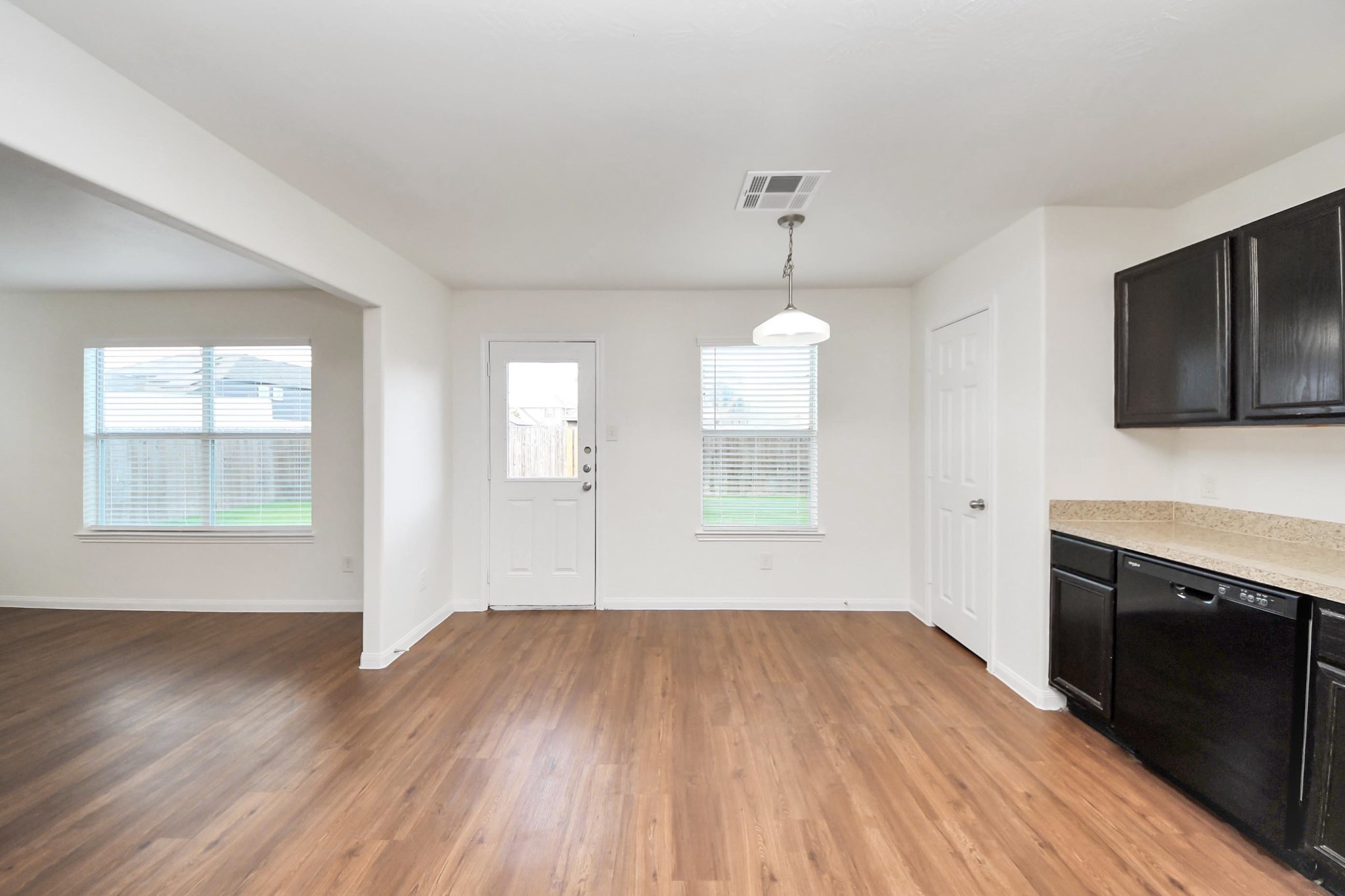 886 Darbydale Crossing Lane Houston, TX 77090 - Photo 16 of 41 an empty room with wooden floor and windows