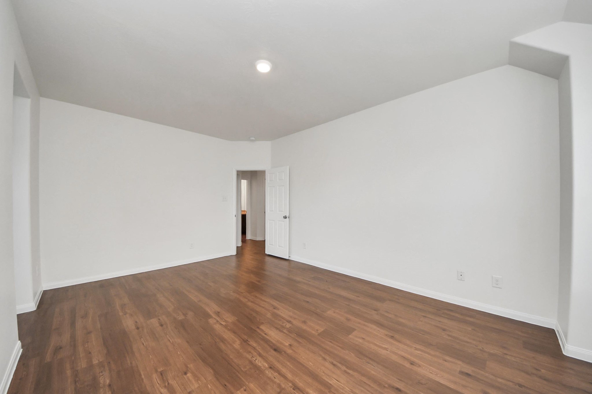 886 Darbydale Crossing Lane Houston, TX 77090 - Photo 21 of 41 a view of an empty room with wooden floor