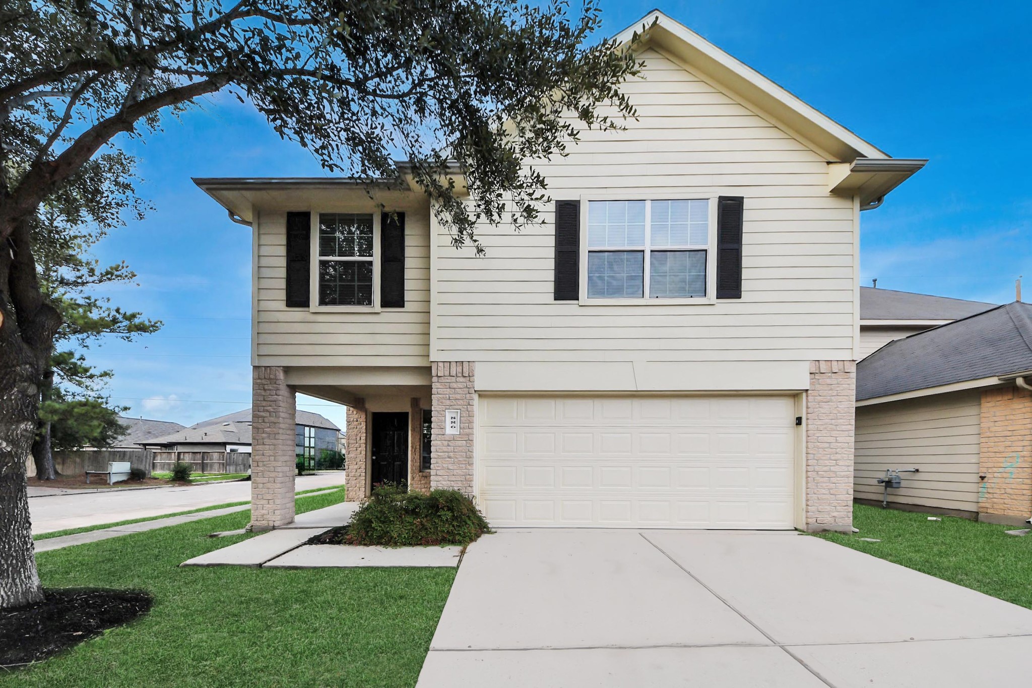 886 Darbydale Crossing Lane Houston, TX 77090 - Photo 4 of 41 a front view of a house with a yard and garage