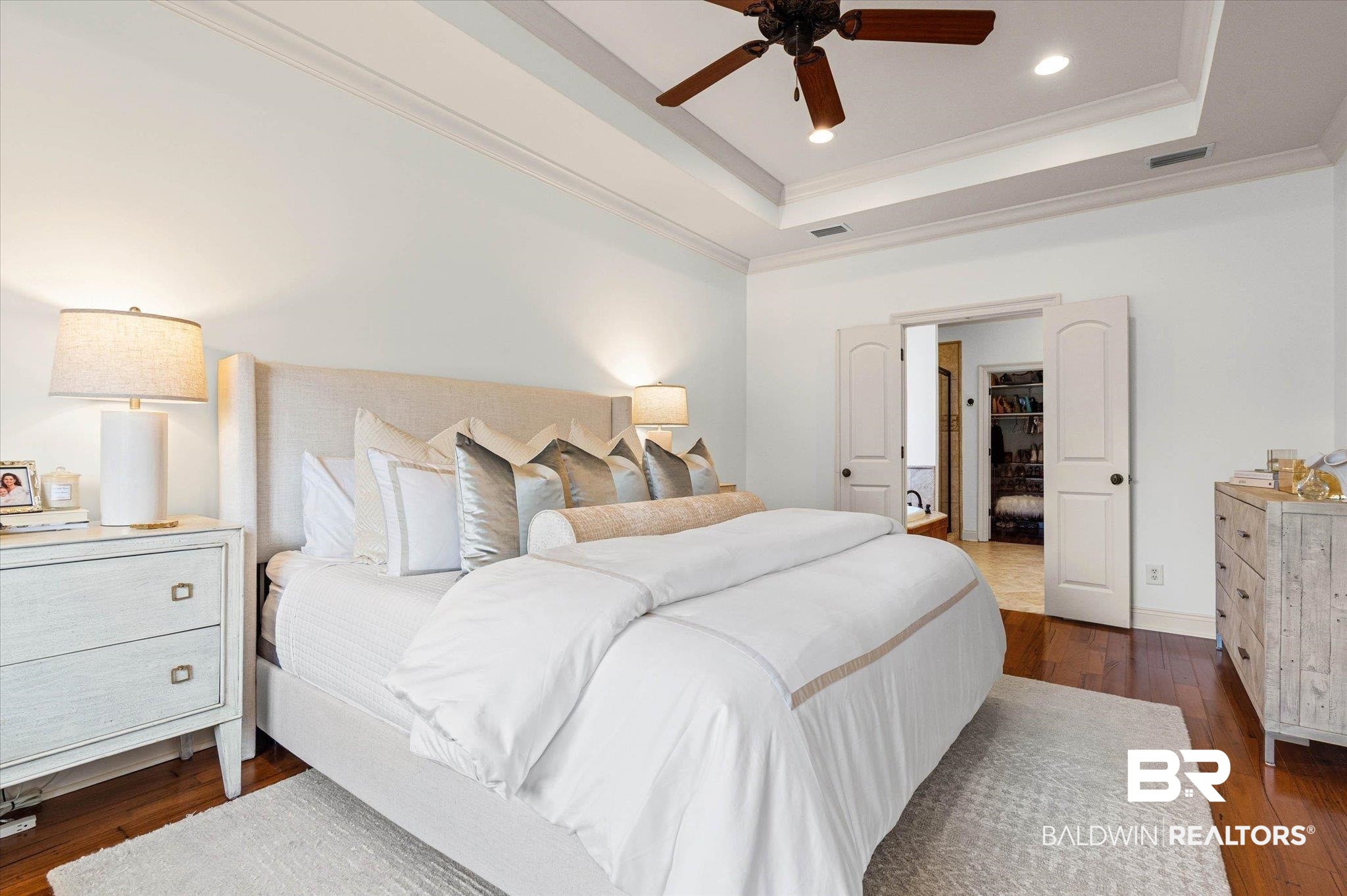 3459 Rue Royal Mobile, AL 36693 - Photo 13 of 31 Bedroom featuring a tray ceiling with a ceiling fan, recessed lighting, and rich wood-finish flooring