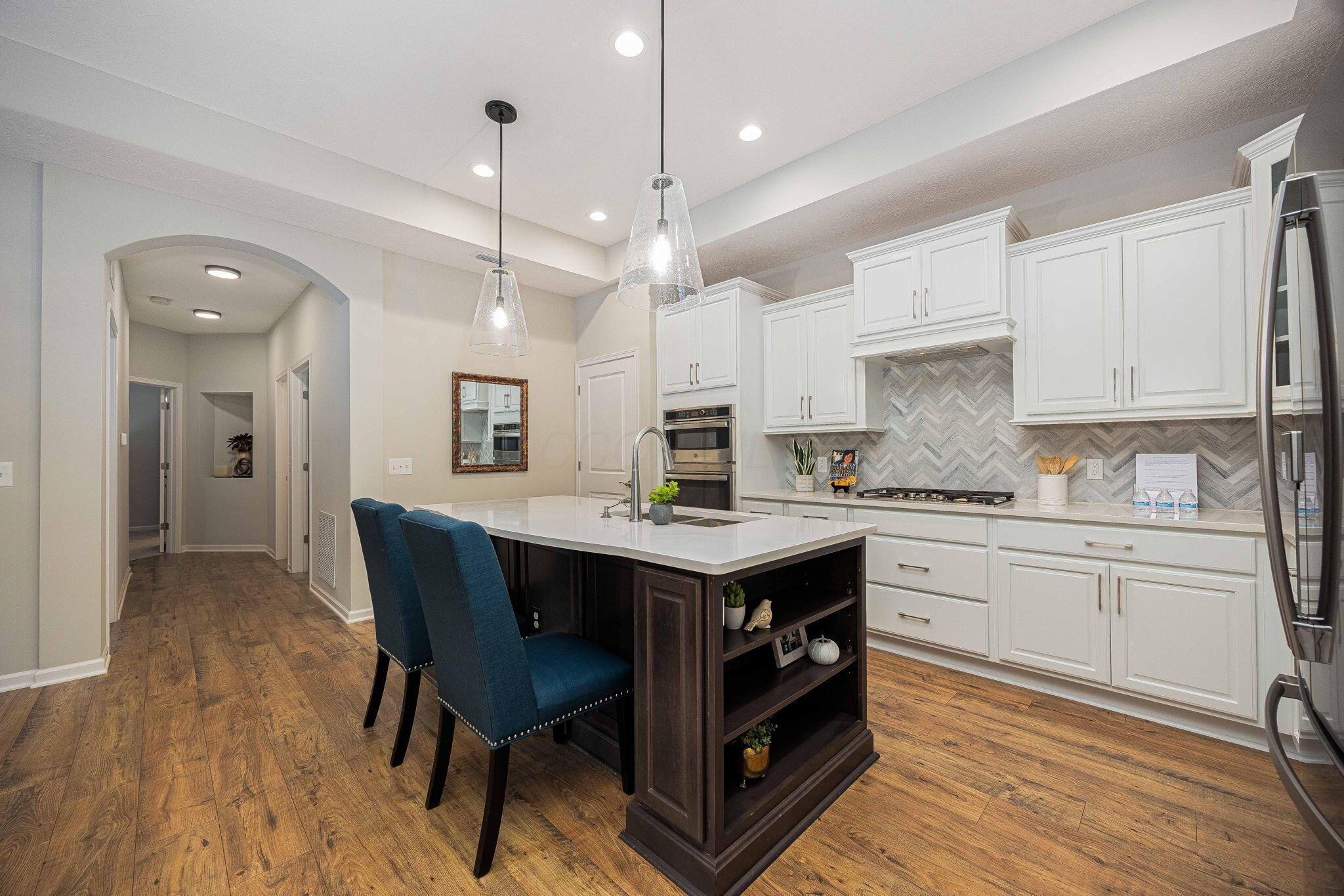6694 Trinity Mist Way Delaware, OH 43015 - Photo 6 of 24 The spacious kitchen island is great for hosting.