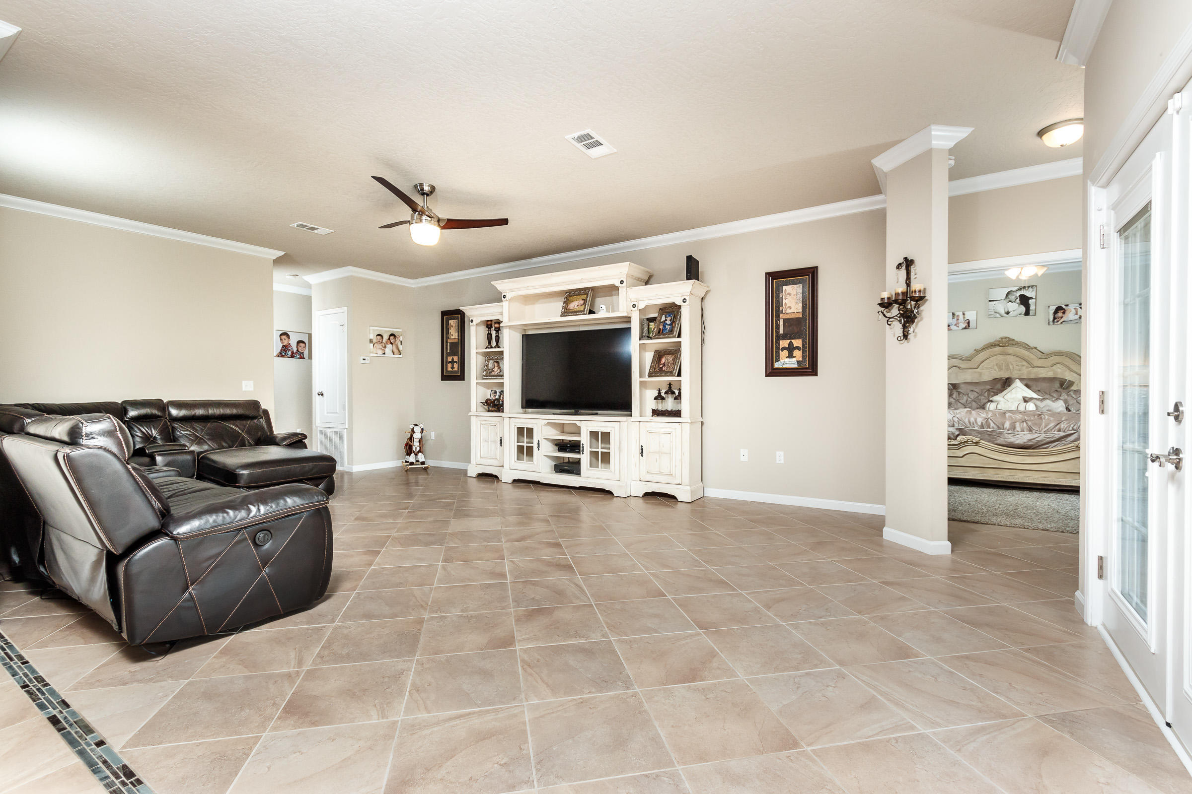 4600 Hermosa Road Crestview, FL 32539 - Photo 2 of 40 a living room with furniture and a flat screen tv