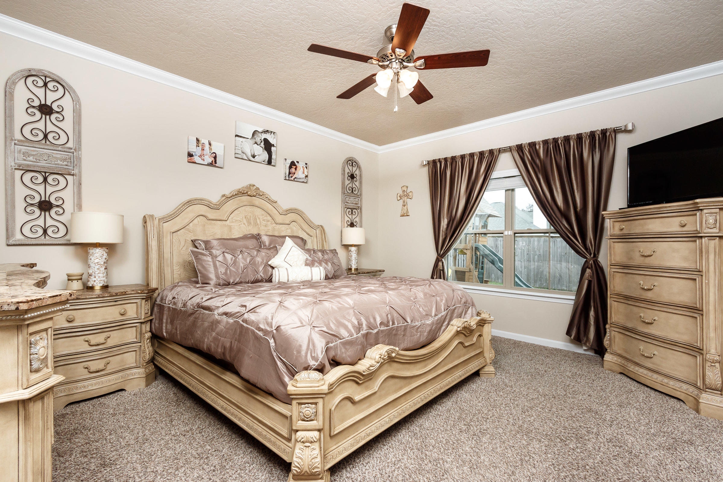 4600 Hermosa Road Crestview, FL 32539 - Photo 13 of 40 a bedroom with a bed a window and dresser