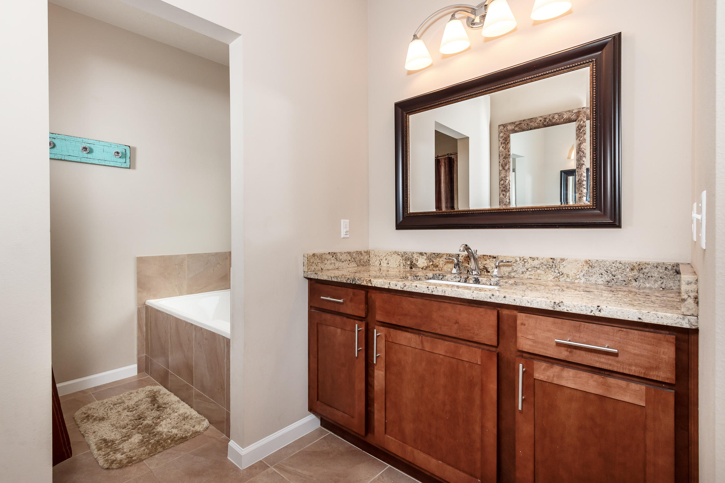 4600 Hermosa Road Crestview, FL 32539 - Photo 17 of 40 a bathroom with a sink vanity and mirror