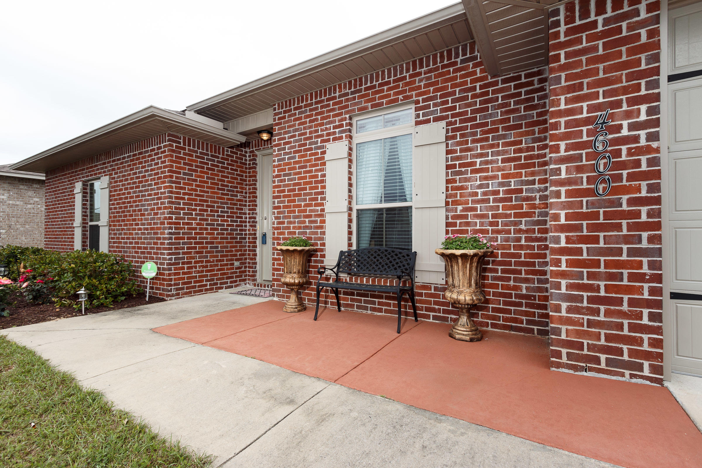 4600 Hermosa Road Crestview, FL 32539 - Photo 32 of 40 a view of house with chair and tables