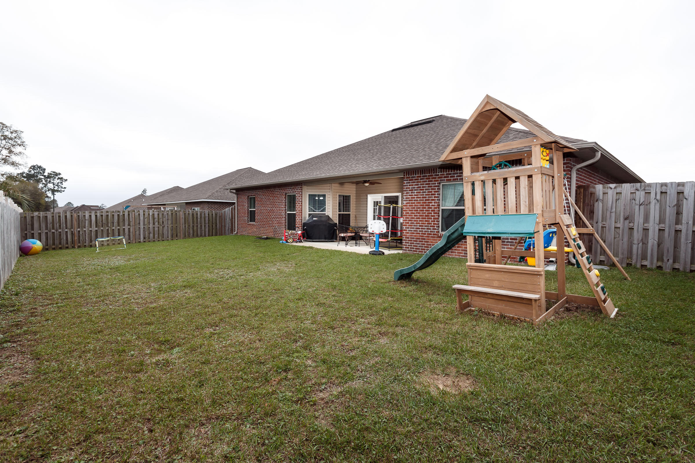 4600 Hermosa Road Crestview, FL 32539 - Photo 34 of 40 a view of a house with a yard porch and sitting area