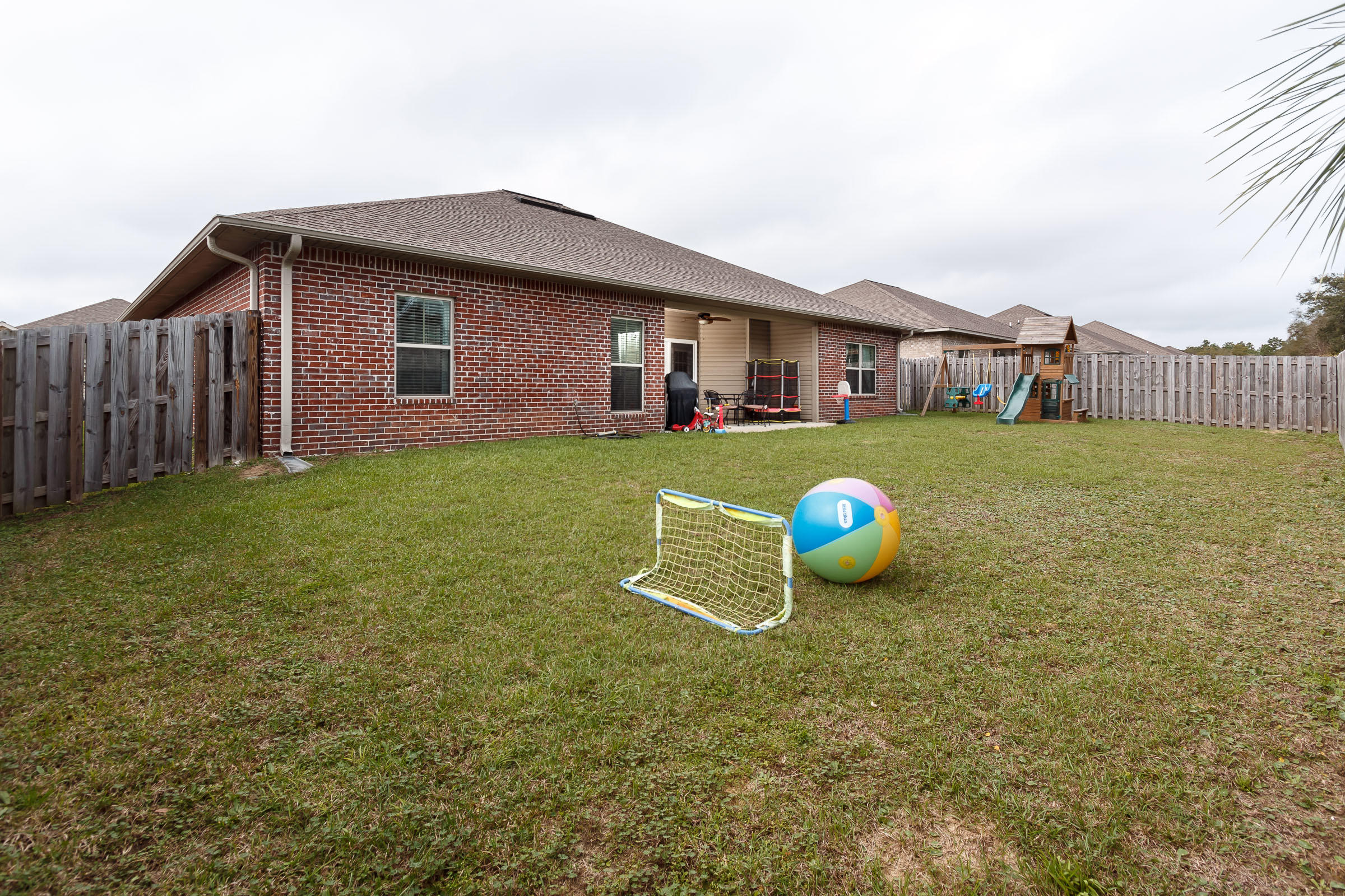 4600 Hermosa Road Crestview, FL 32539 - Photo 36 of 40 a front view of a house with garden