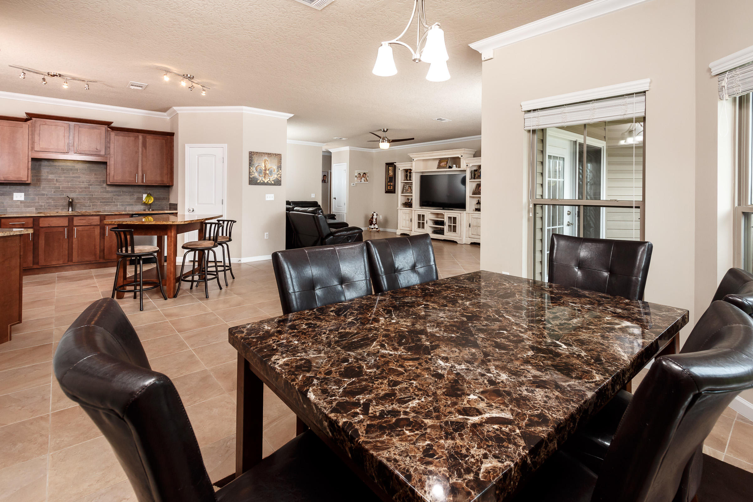 4600 Hermosa Road Crestview, FL 32539 - Photo 7 of 40 a living room with dining room and wooden floor