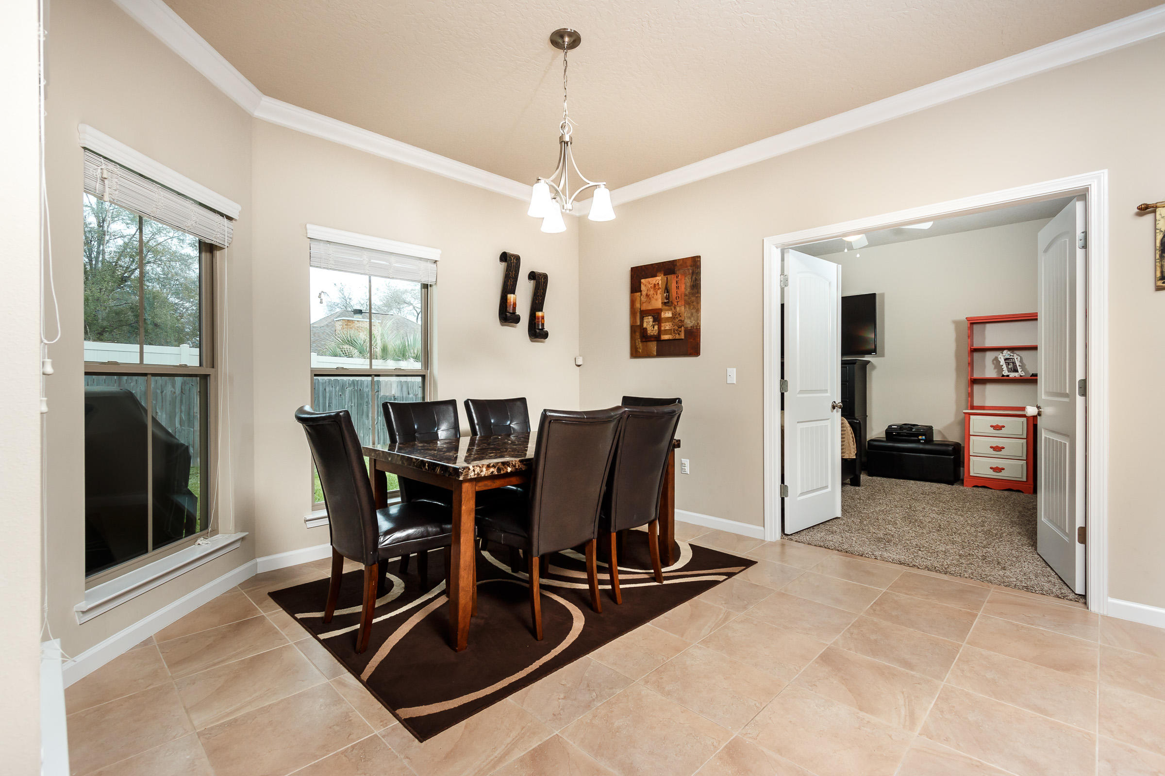 4600 Hermosa Road Crestview, FL 32539 - Photo 9 of 40 a view of a dining room with furniture and window