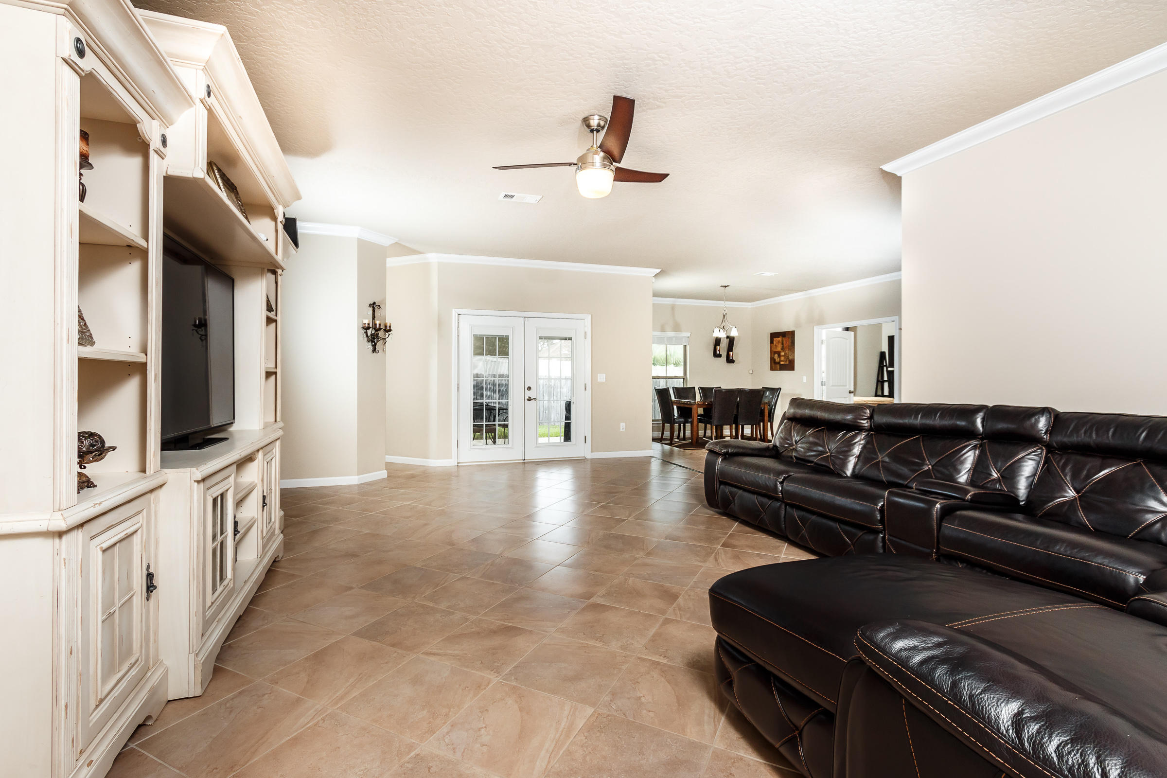 4600 Hermosa Road Crestview, FL 32539 - Photo 10 of 40 a living room with furniture and a flat screen tv