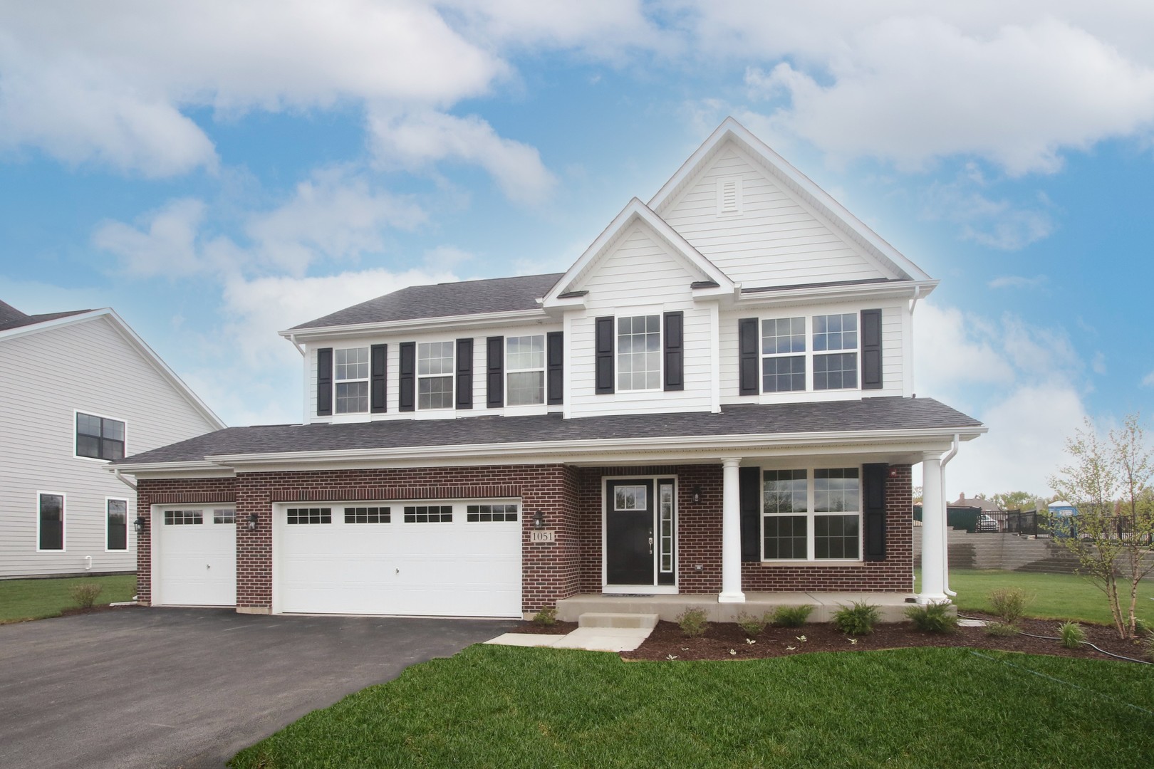 1060 Avery Rdg Circle, Unit 27 Lake Zurich, IL 60047 - Photo 1 of 1 a front view of a house with a yard and trees