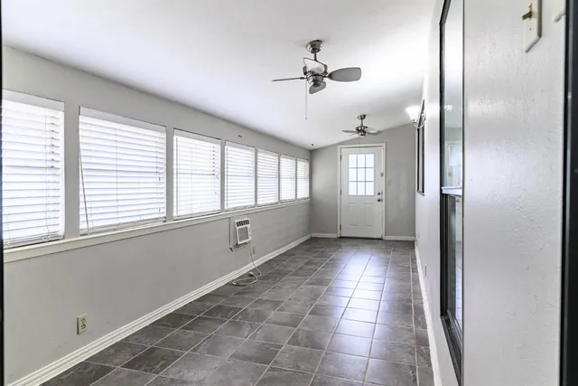 a view of an empty room and window