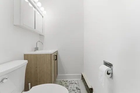 a bathroom with a toilet and a sink