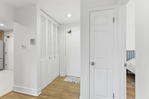 a view of a hallway with closet area