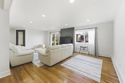 a living room with furniture and a rug