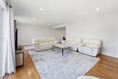 a living room with furniture and a rug