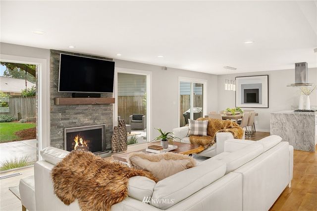 a living room with furniture fireplace and a flat screen tv