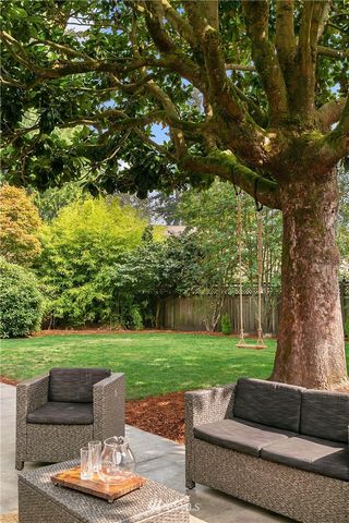 a view of a garden with an outdoor seating