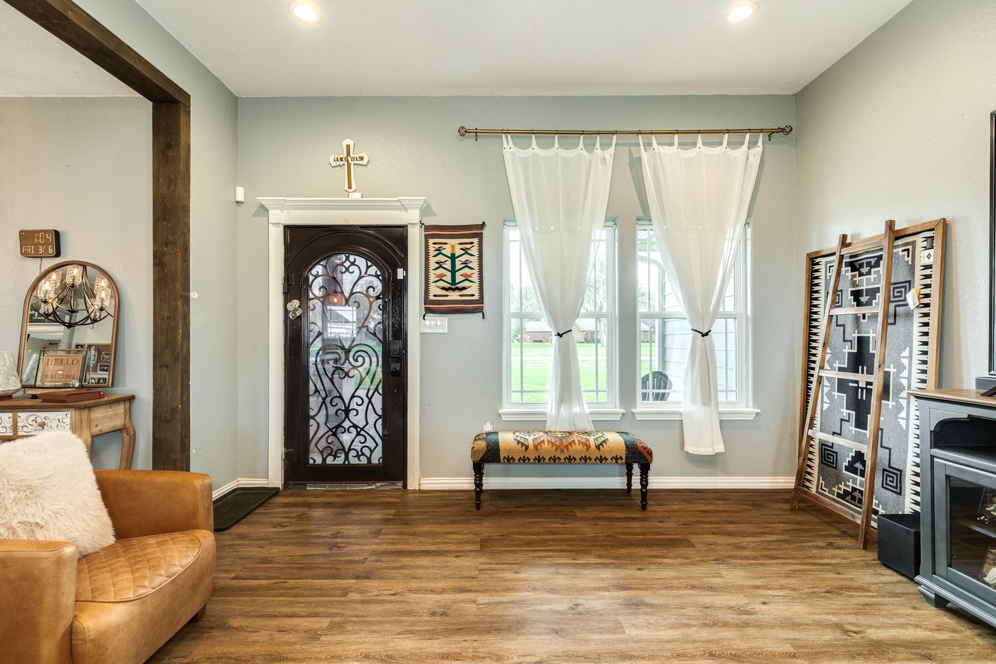 613 Winchester Trail Angleton, TX 77515 - Photo 11 of 32 a living room with furniture and a large window