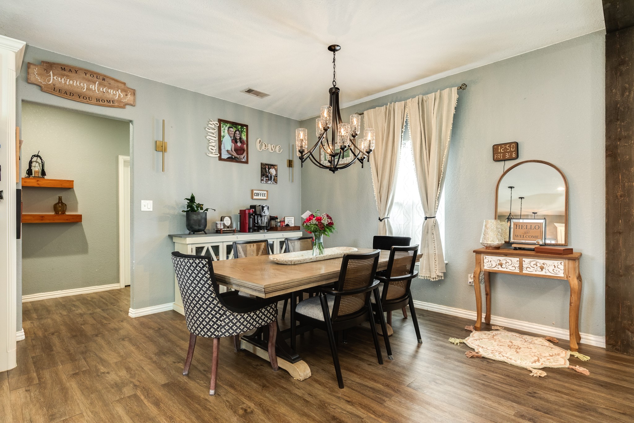 613 Winchester Trail Angleton, TX 77515 - Photo 13 of 32 a view of a dining room with furniture window and wooden floor
