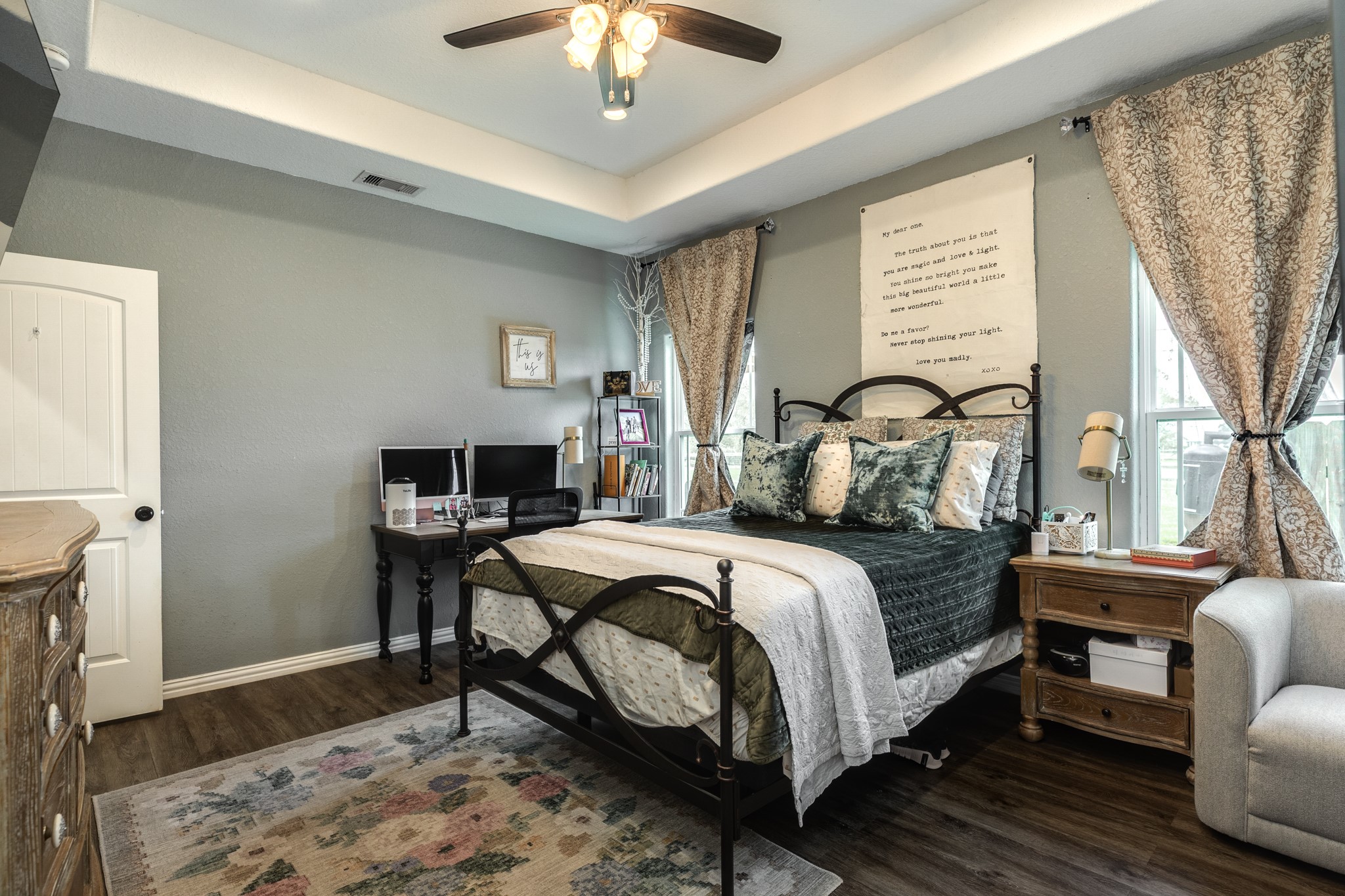 613 Winchester Trail Angleton, TX 77515 - Photo 19 of 32 a bedroom with a bed wooden floor and a table