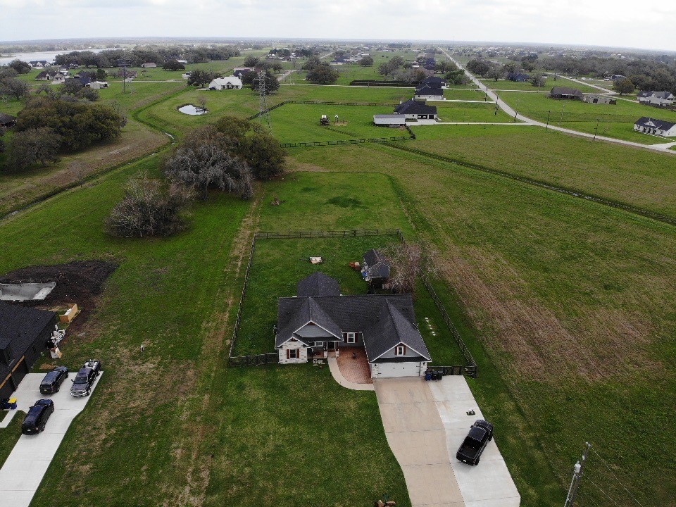 613 Winchester Trail Angleton, TX 77515 - Photo 30 of 32 an aerial view of a house with a garden