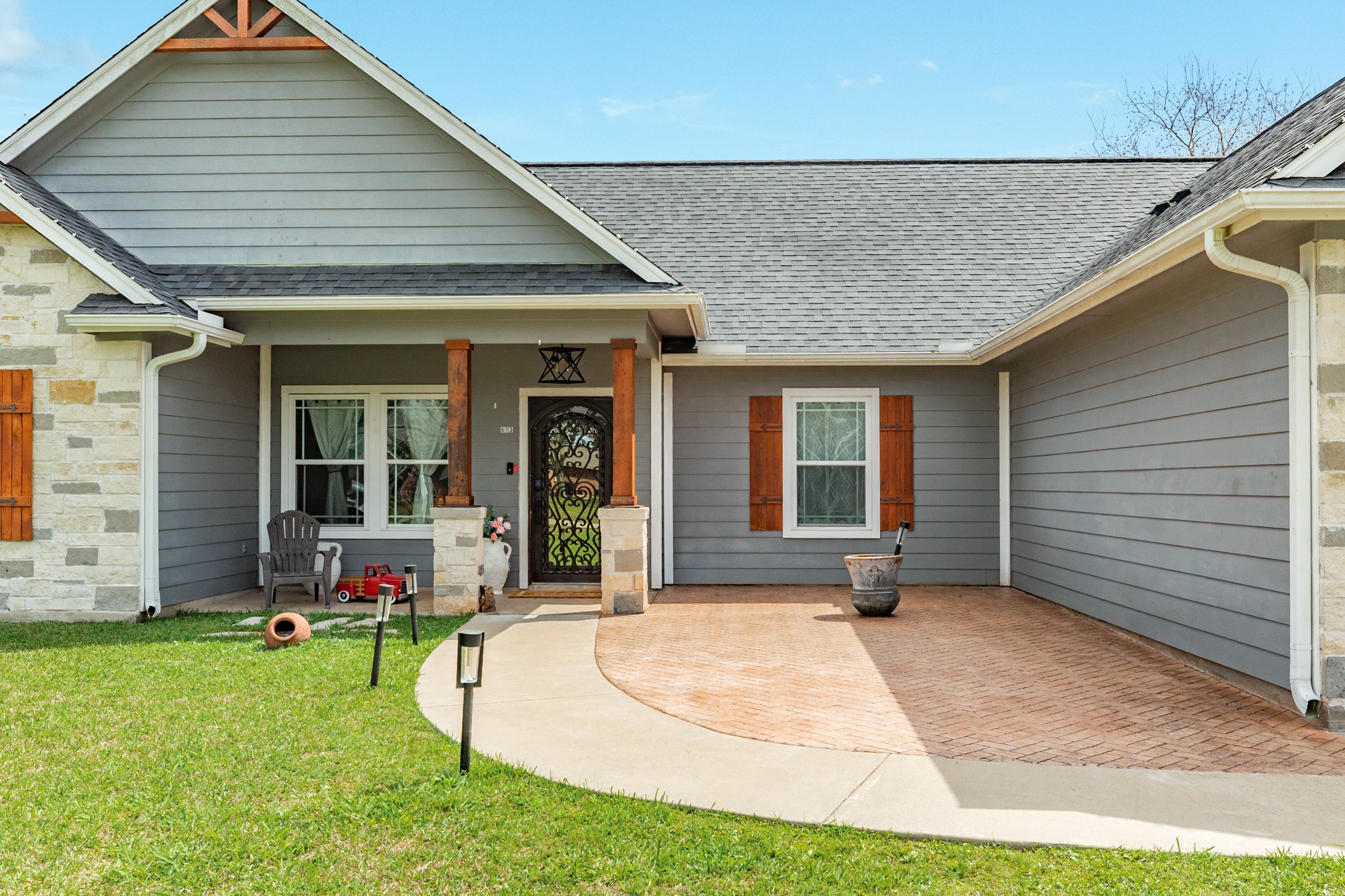 613 Winchester Trail Angleton, TX 77515 - Photo 3 of 32 a view of a house with sitting area and porch
